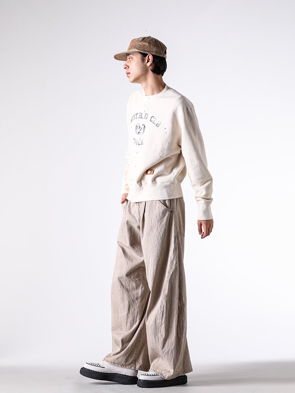 KHOKI - 25AW - Full Outfit Photo Gallery - 25fw-jk-07 - Vintage-effect puffer jacket - 25fw-t-03 - Vintage-effect sweat cardigan - 25fw-p-12 - 3D cutting denim pants - G15CA104 - CA4LA × KAMIYA K-Wing Distressed Cap - S14FW710 - THAMES / Suede Interlace Shoes 3-005