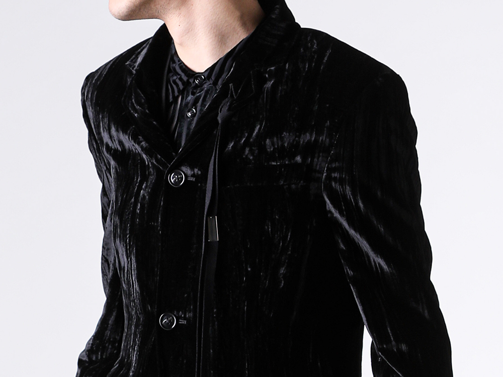 Grosgrain ribbon hanging from the flower hole