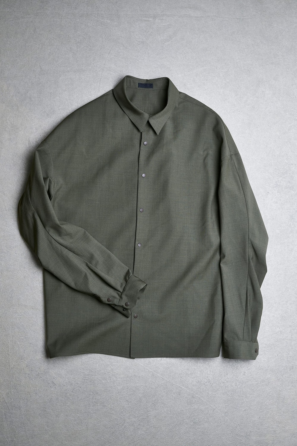 Image conveying the complex hues and drape of the khaki fabric