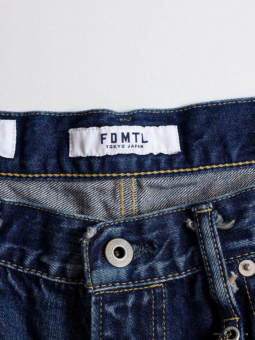 Product shot of multiple denims lined up