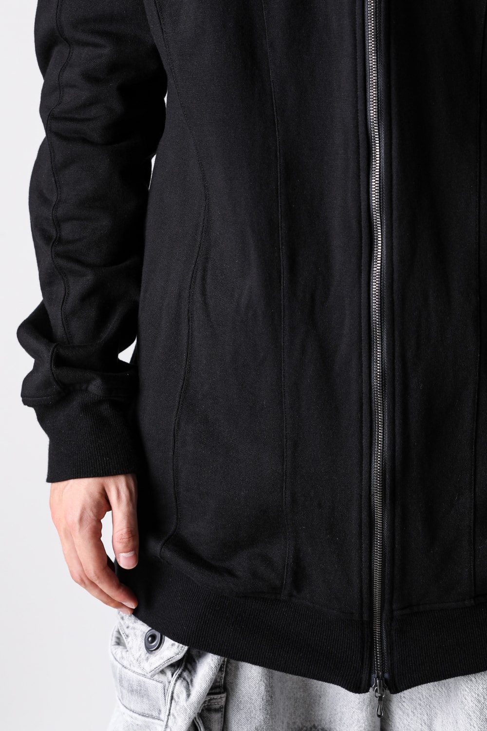 Close-up of the split stitching on the arms and hood seams