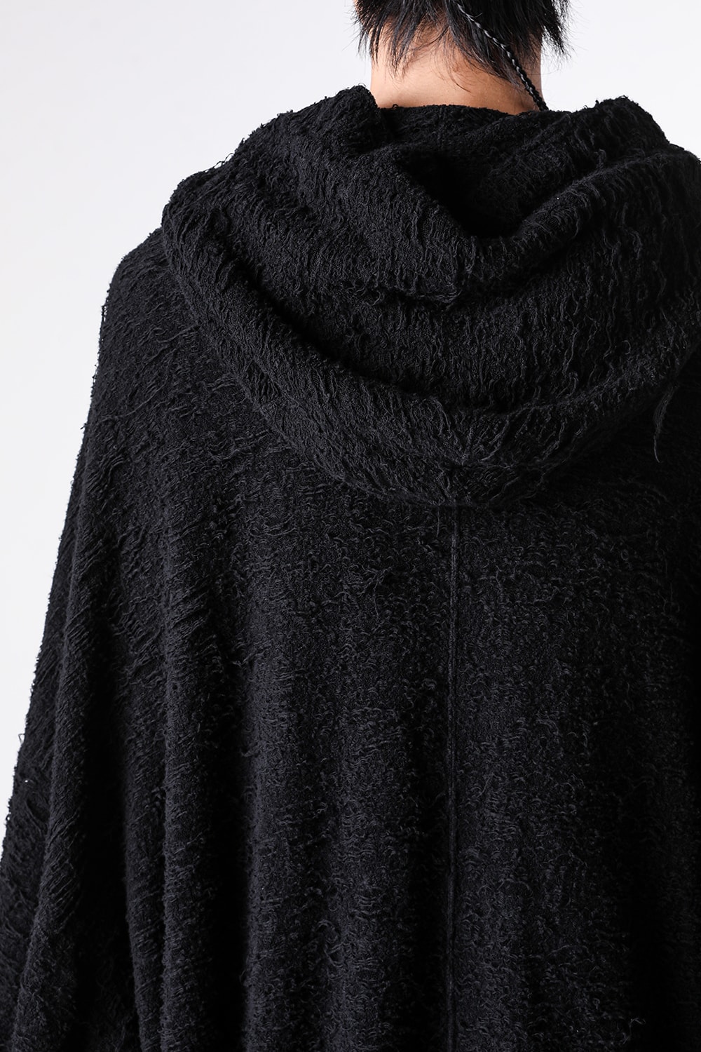 Extreme close-up showing the textured surface of the pile jacquard fabric