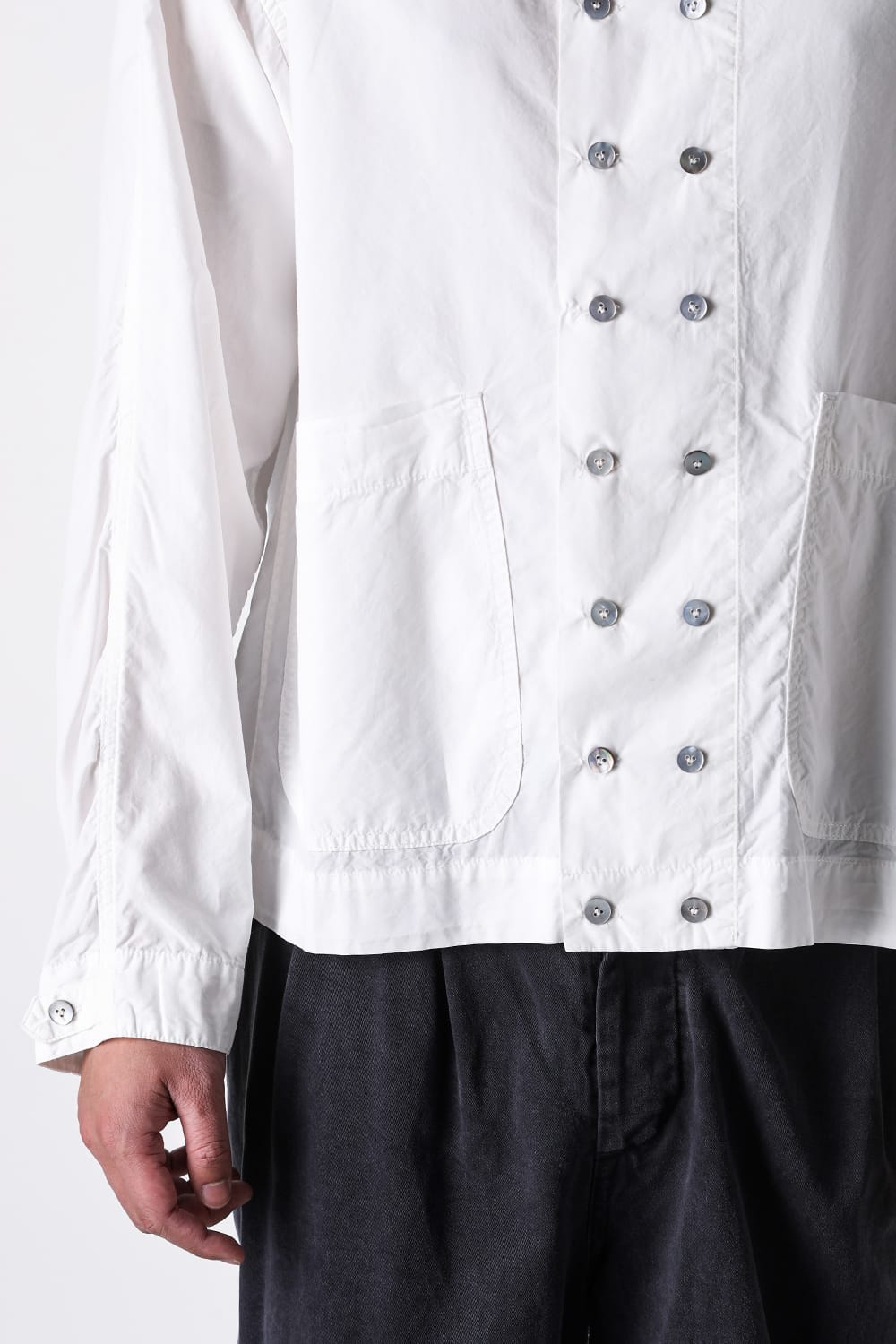 Detail image of the front buttons, collar, or side buttons