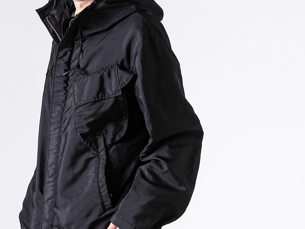 Left chest pocket and detail image of the Ten C FAIR ANORAK