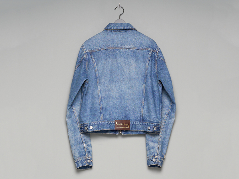 Rear view image of the jacket hung on a hanger