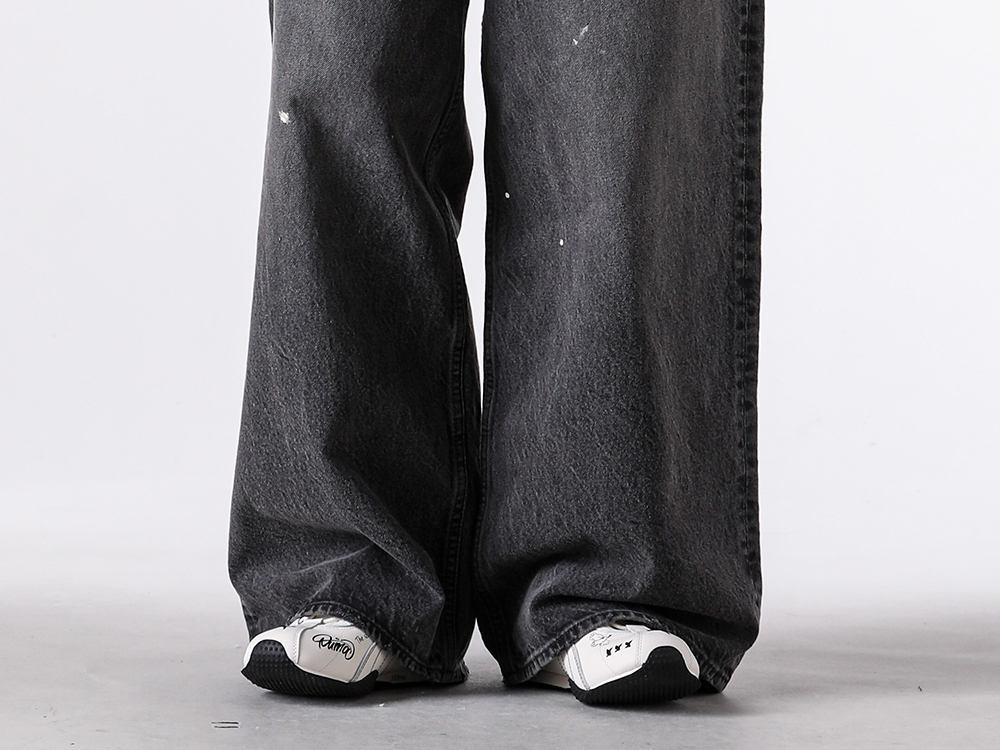 Image of the sharp toe peeking out from wide pants