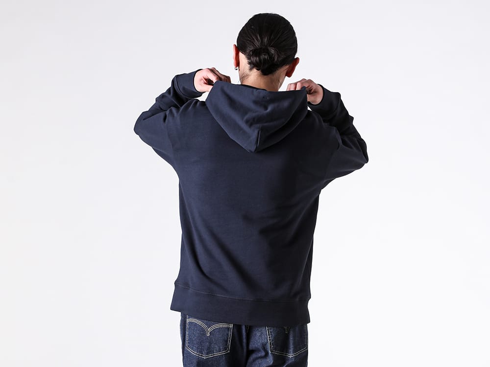 Close-up of the hoodie's hood and logo patch