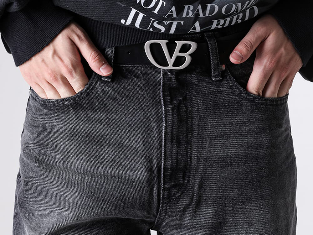 Worn image of the doublet belt styled with slacks