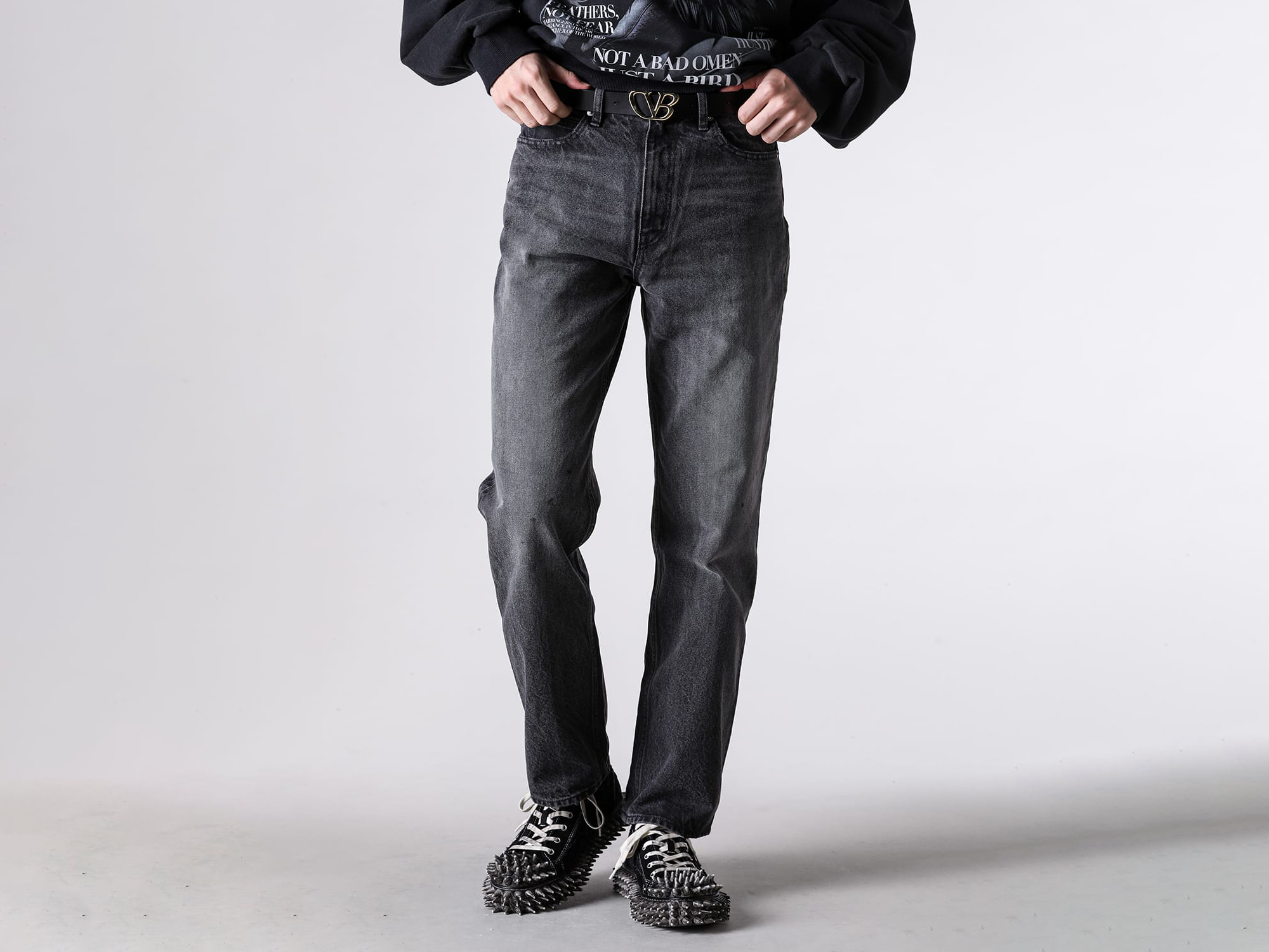 Worn image of the doublet belt styled with slacks