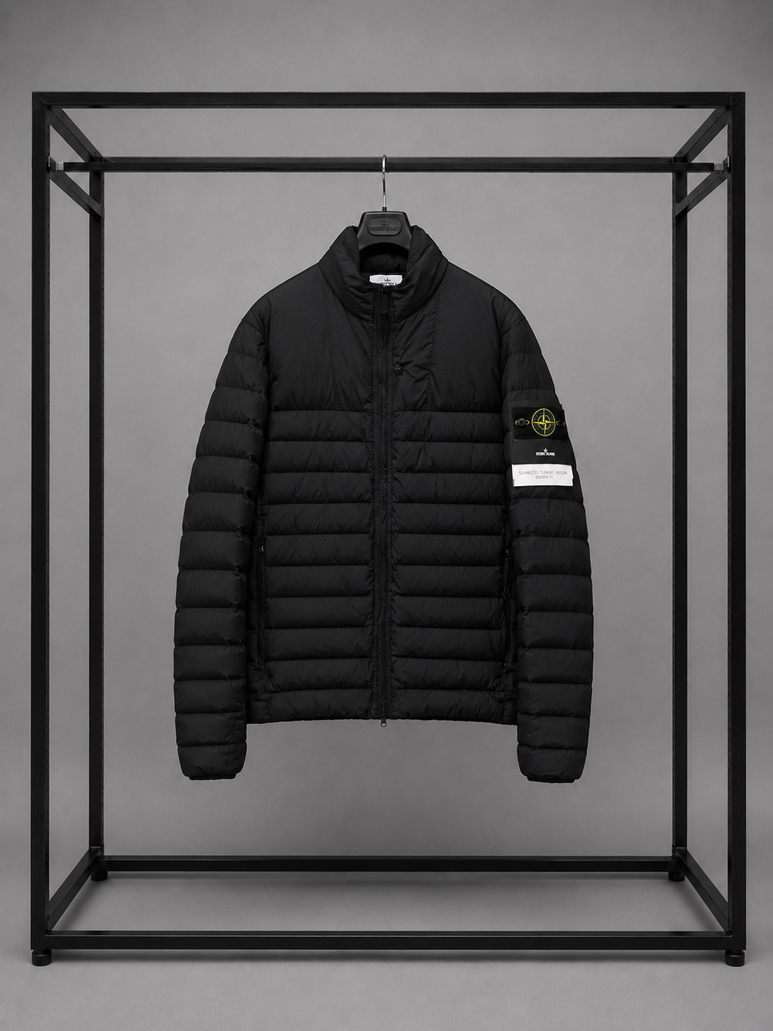 Detail image of outerwear with a glossy feel like nylon metal