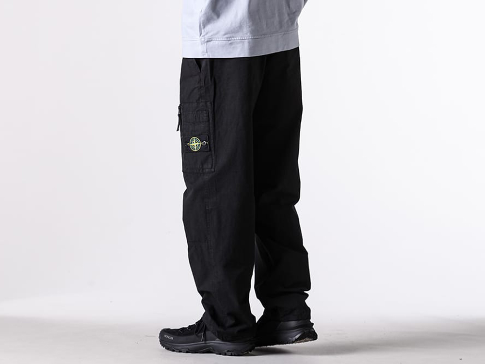 Close-up view showing the fabric texture and character of the STONE ISLAND pants
