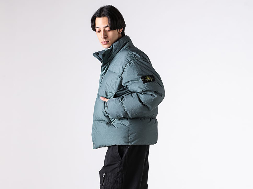 Close-up view of the stand collar area of the STONE ISLAND down jacket