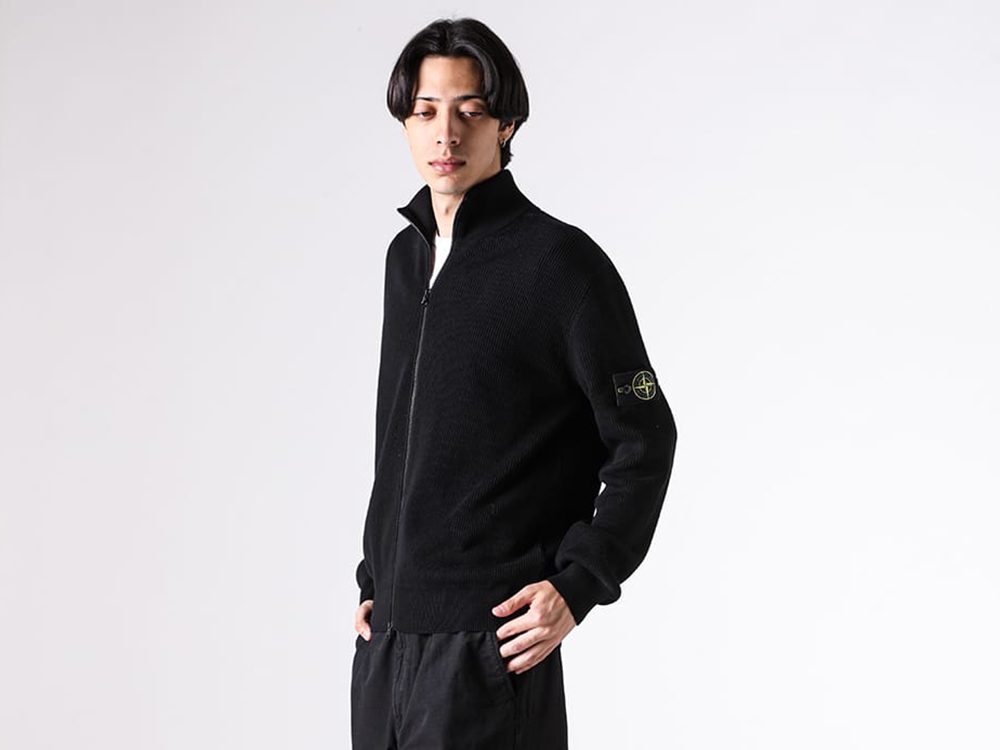 Close-up view of the back shoulder detail on the STONE ISLAND cardigan