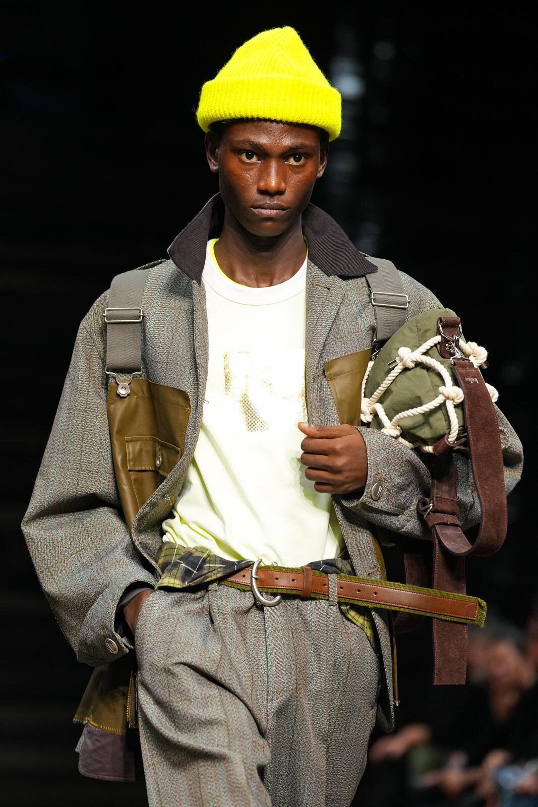 kolor 2026 Autumn/Winter 'The Waves' look (upper body) pairing a fluorescent yellow knit cap with a woven rope bag