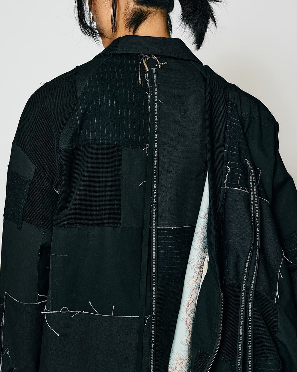 The intricate fabric construction of the ISŌ: Phase 25FW patchwork blouson